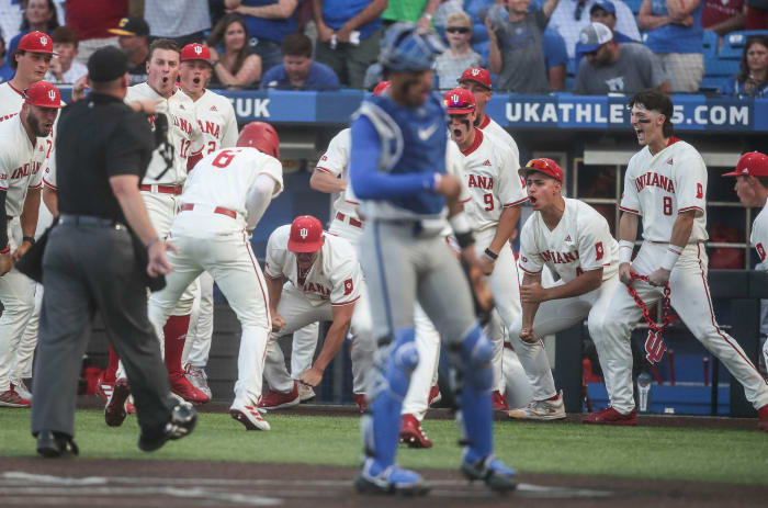 Indiana's Tyler Cerny (8) was ejected from the game after he carried an IU prop -- the IU logo on a chain -- onto the field as the Hoosiers celebrate Peter Serruto's three-run homer in the seventh. The Hoosiers defeated Kentucky 5-3 Saturday night in the 2023 NCAA Regional at Kentucky Proud Park in Lexington.
